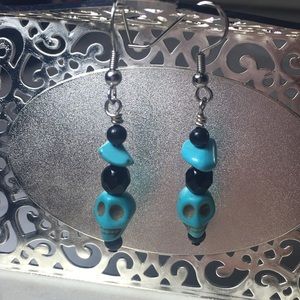 Blue dangle skull earrings